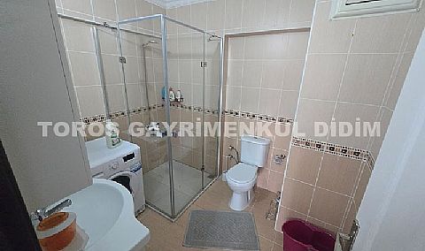 Didim Altınkum havuzlu sitede satılık 3+1  eşyalı geniş bakonlu orta kat daire