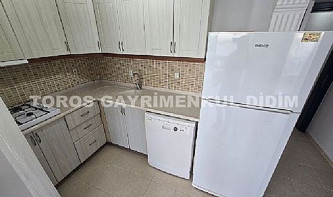 Didim Altınkum havuzlu sitede satılık 3+1  eşyalı geniş bakonlu orta kat daire