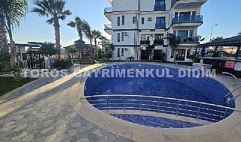 Didim altınkumda havuzlu güvenlikli sitede satılık eşyalı dubleks daire