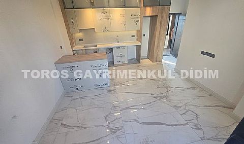 didim çamlıkta denize 400 mt mesafede satılık 1+1 daire