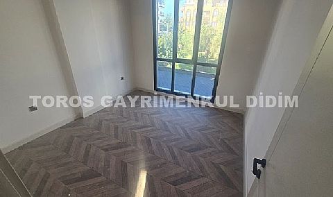 didim çamlıkta denize 400 mt mesafede satılık 1+1 daire