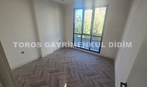 didim çamlıkta denize 400 mt mesafede satılık 1+1 daire