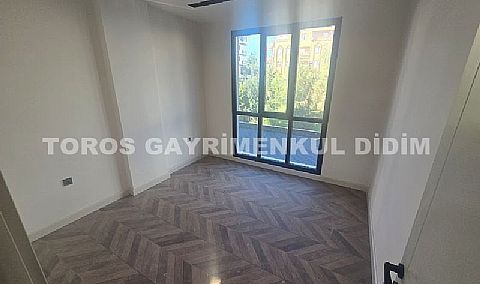 didim çamlıkta denize 400 mt mesafede satılık 1+1 daire