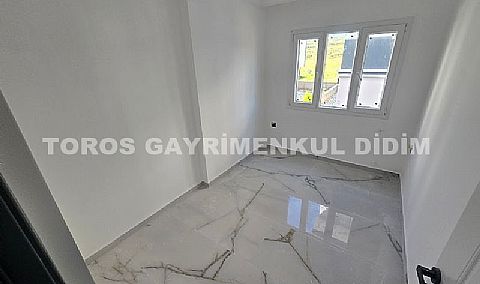 Didim cumhuriyet mahallesinde Asansörlü Binada satılık 2+1 daire 