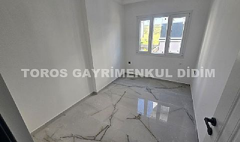Didim cumhuriyet mahallesinde Asansörlü Binada satılık 2+1 daire 