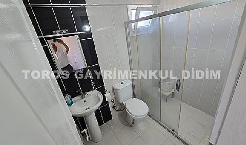Didim Hisar Mahallesi'nde Yaz-Kış Oturuma Uygun, 95 m² Genişliğinde Kısmi Ayrı Mutfaklı satılık 2+1