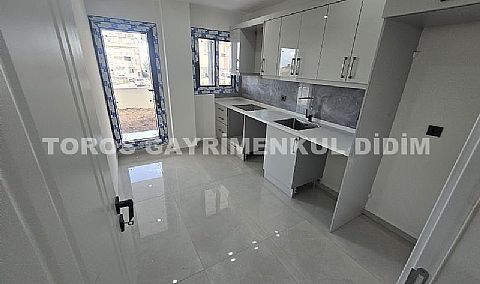 Didim hisarda satılık bahçeli giriş kat ayrı mutfaklı daire