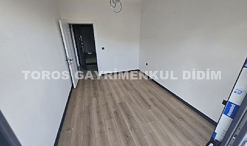 Didim hisarda satılık bahçeli giriş kat ayrı mutfaklı daire