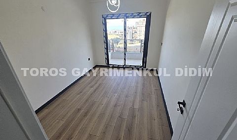 Didim hisarda satılık bahçeli giriş kat ayrı mutfaklı daire