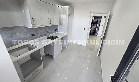 Didim hisarda satılık bahçeli giriş kat ayrı mutfaklı daire