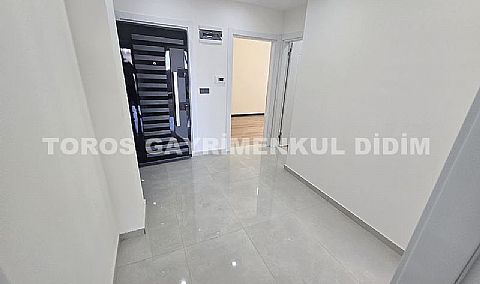 Didim hisarda satılık bahçeli giriş kat ayrı mutfaklı daire