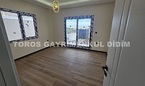 Didim hisarda satılık bahçeli giriş kat ayrı mutfaklı daire