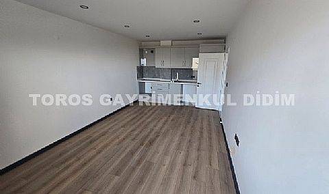 Didim hisarda satılık bahçeli giriş kat ayrı mutfaklı daire