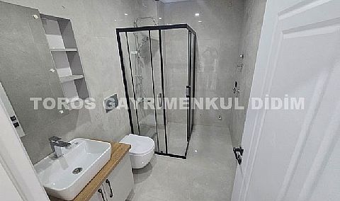 Didim hisarda satılık bahçeli giriş kat ayrı mutfaklı daire