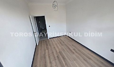 Didim hisarda satılık bahçeli giriş kat ayrı mutfaklı daire