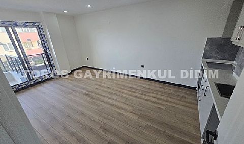 Didim hisarda satılık bahçeli giriş kat ayrı mutfaklı daire