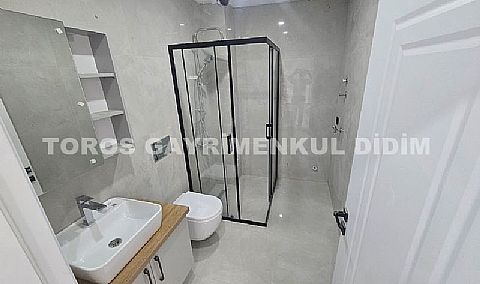 Didim hisarda satılık bahçeli giriş kat ayrı mutfaklı daire