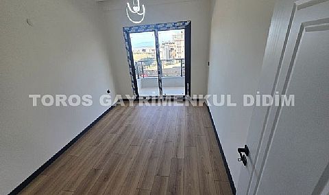 Didim hisarda satılık bahçeli giriş kat ayrı mutfaklı daire