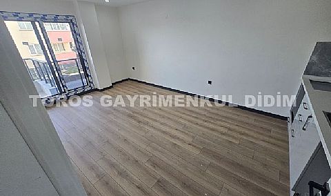 Didim hisarda satılık bahçeli giriş kat ayrı mutfaklı daire