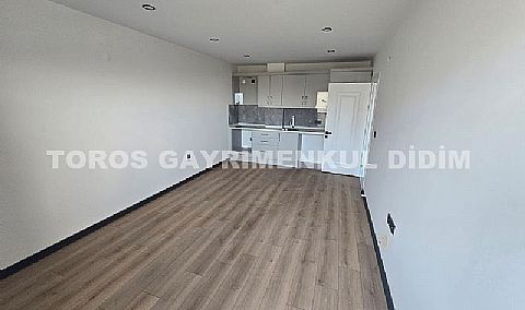 Didim hisarda satılık bahçeli giriş kat ayrı mutfaklı daire