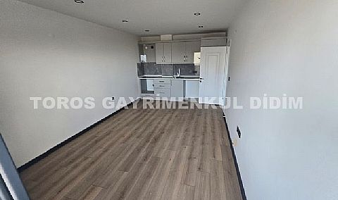 Didim hisarda satılık bahçeli giriş kat ayrı mutfaklı daire