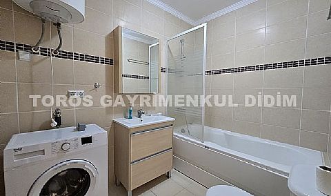 Didimde Havuzlu güvenlikli sitede satılık eşyalı 2+1 yazlık daire